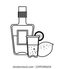 tequila bottle with cup and lemon