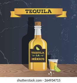 Tequila bottle with cup and lime