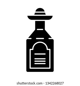 Tequila glyph icon. Mexican strong alcoholic drink. Bottle with sombrero bung. Silhouette symbol. Negative space. Vector isolated illustration