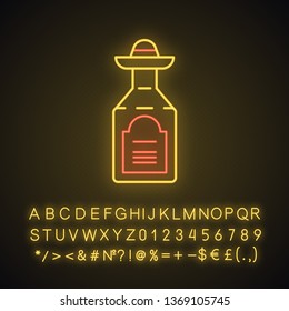 Tequila neon light icon. Mexican strong alcoholic drink. Bottle with sombrero bung. Glowing sign with alphabet, numbers and symbols. Vector isolated illustration