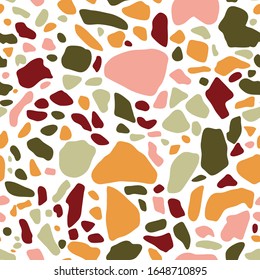 Terrazzo floor covering seamless pattern in green, terracotta, pink and yellow colors. Vector background of the Italian floor in the Venetian style. Granite texture in a trendy style.