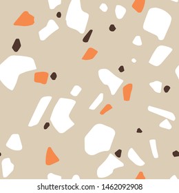 Terrazzo seamless pattern. Abstract mosaic vector trendy repeat design for wallpaper, fabric, textile with  beige background, brown, orange and white hand drawn abstract shapes. 
