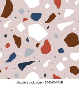 Terrazzo seamless pattern with colorful splinters or fragments. Decorative backdrop with stone pieces scattered on light background. Modern vector illustration for textile print, wrapping paper.