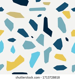 Terrazzo seamless pattern of large blue yellow fragments on white background.