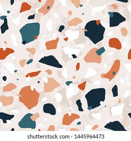 Terrazzo seamless pattern with motley rock crumbs or chips. Traditional Italian backdrop with stone fragments scattered on light background. Natural vector illustration for textile print, wallpaper.
