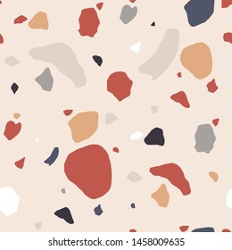 Terrazzo seamless pattern with motley rock splinters. Trendy backdrop with stone crumbs or sprinkles scattered on light background. Modern vector illustration for wallpaper, textile print, flooring.