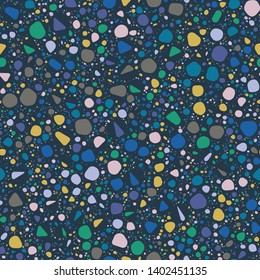 Terrazzo Seamless Repeat Vector Pattern.  Soft rounded elements. Blue, Purple, Green, Yellow, and Neutrals, on navy.  Thousands of random non-overlapping elements.  Generative Art (made with code). 