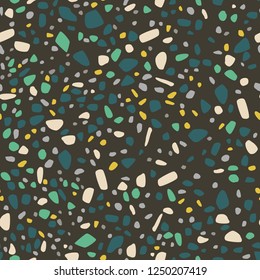 Terrazzo style pattern on dark background with green and yellow fragments/abstract geometrical seamless pattern EPS10 vector illustration