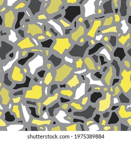 Terrazzo vector seamless pattern with grey and yellow abstract shapes on grey background. Modern abstract style. Handmade illustration in colors of the year. Perfect for fabrics and wrapping paper.