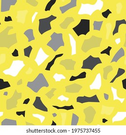 Terrazzo vector seamless pattern with grey abstract shapes on yellow background. Modern abstract style. Handmade illustration in colors of the year. Perfect for fabrics and wrapping paper.