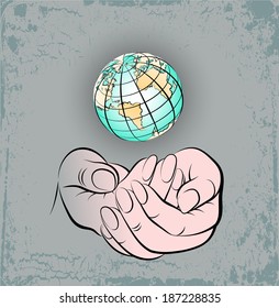 The terrestrial globe over a palms of a hand of the person.