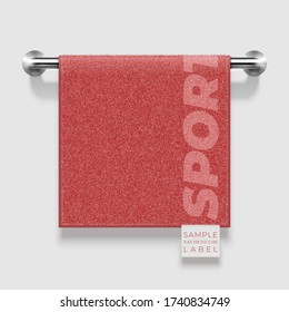 Terry towel with label template hanging on metallic holder. Vector realistic mockup illustration.