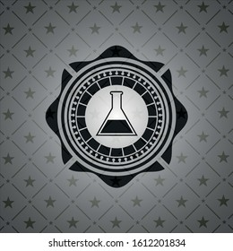 test tube icon inside black emblem