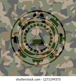 test tube icon inside camouflaged emblem