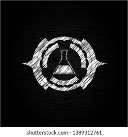 test tube icon inside chalkboard emblem written on a blackboard