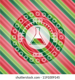 test tube icon inside christmas colors emblem.