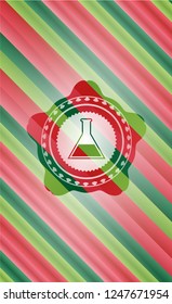 test tube icon inside christmas style emblem.