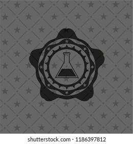 test tube icon inside dark emblem
