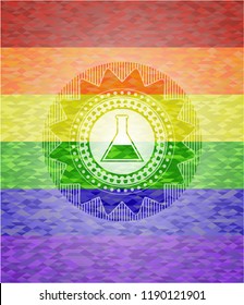 test tube icon inside emblem on mosaic background with the colors of the LGBT flag