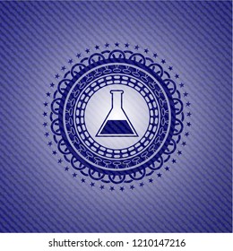 test tube icon inside emblem with jean high quality background