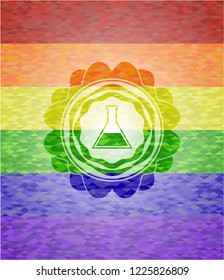 test tube icon inside emblem on mosaic background with the colors of the LGBT flag