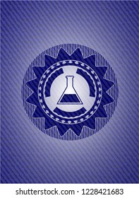 test tube icon inside emblem with denim high quality background