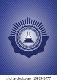 test tube icon inside emblem with denim high quality background