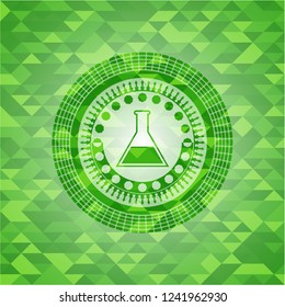 test tube icon inside green emblem with mosaic ecological style background
