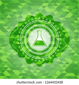 test tube icon inside green mosaic emblem