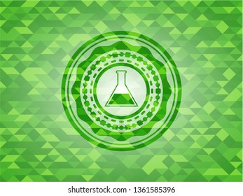 test tube icon inside green mosaic emblem