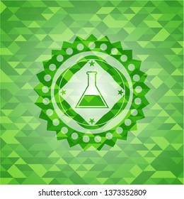 test tube icon inside green emblem with mosaic ecological style background
