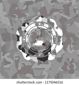 test tube icon inside grey camouflage texture