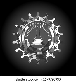 test tube icon inside grey camouflage texture