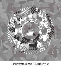test tube icon inside grey camouflage texture