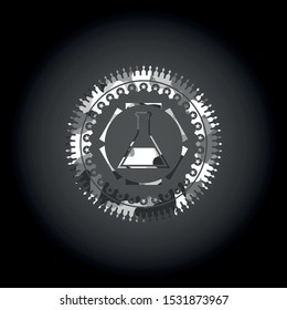 test tube icon inside grey camouflage emblem