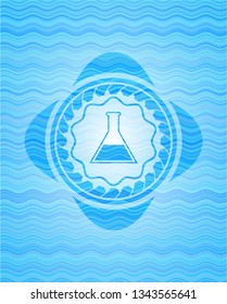 test tube icon inside light blue water style emblem.