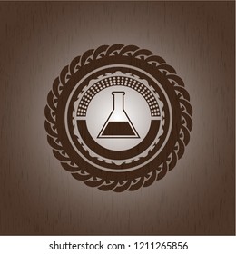 test tube icon inside realistic wooden emblem