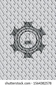 test tube icon inside shiny silver emblem. Scales pattern. Vector Illustration. Detailed.