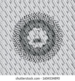 test tube icon inside silver badge. Scales pattern. Vector Illustration. Detailed.