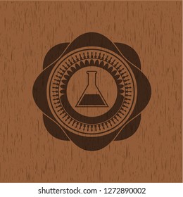 test tube icon inside wooden emblem. Vintage.
