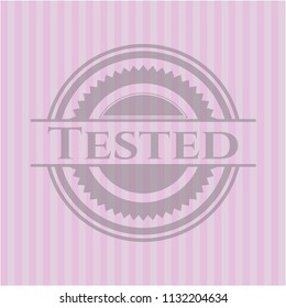 Tested badge with pink background