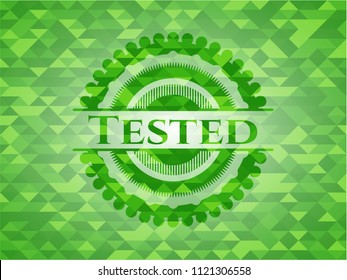 Tested green emblem with triangle mosaic background