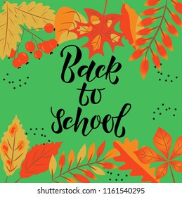 Text BACK TO SCHOOL-hand lettering. Orange leaves on a green background. Design element for the design of leaflets, cards, envelopes, covers, flyers. Vector illustration EPS 10. 

