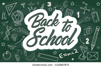  Text back to school.Various hand-drawn school items on a green board  background