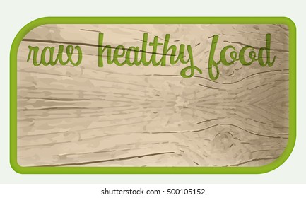 A text box for your text and wooden background and the words raw healthy food