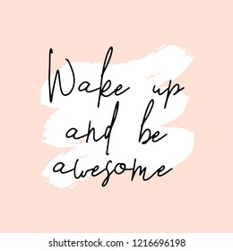 Text Wake Up and Be Awesome written in black, white brushtrokes and pastel pink background. Creative and modern square wall art, social media post, greeting card, t-shirt design.