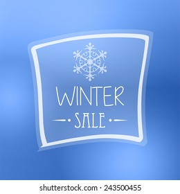 text winter sale with snowflake in frame over blue background