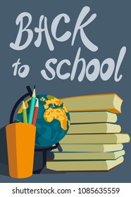 Textbooks, a glass with pencils and a globe, back to school
