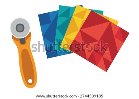 Textile craft equipment with geometric pattern fabric samples and rotary blade tool for handmade patchwork projects