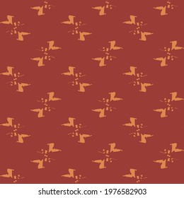 Textile pattern with bow tie symbols. Red scarf decorated with orange.